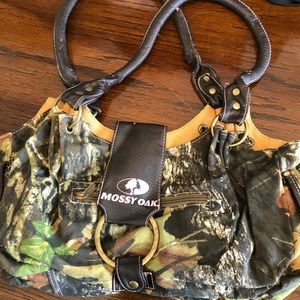 Mossy Oak camo purse. Wear on leather as shown